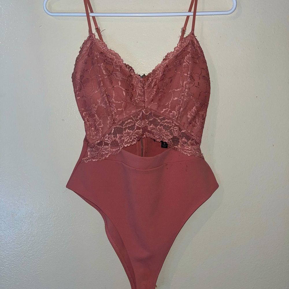 Pink lace body suit